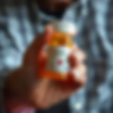 Medication and Management A close-up of an elderly person's hand holding a prescription bottle, symbolizing medication and care.